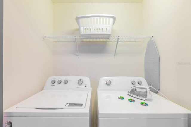 laundry area with independent washer and dryer