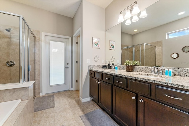 bathroom featuring tile patterned floors, vanity, and plus walk in shower