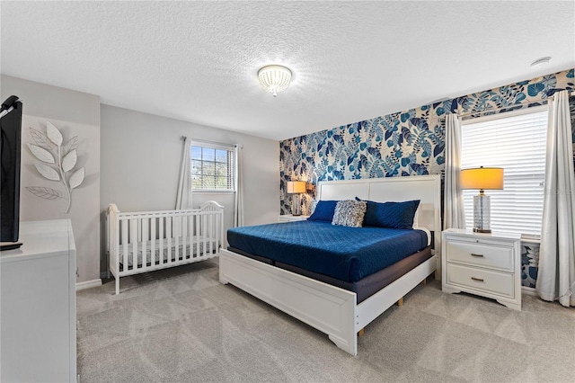 carpeted bedroom with a textured ceiling