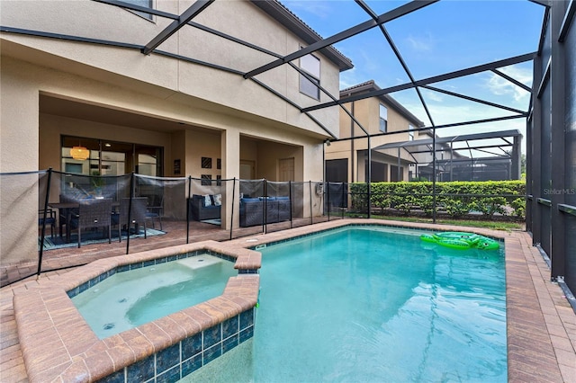 view of pool featuring an in ground hot tub, a lanai, and a patio area