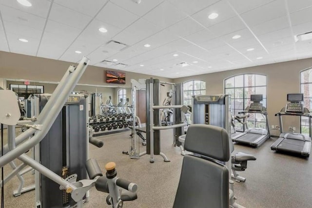 workout area with a paneled ceiling