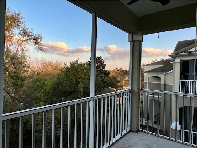 balcony at dusk with ceiling fan