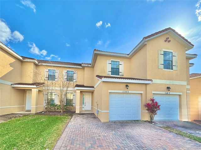 view of front of home with a garage