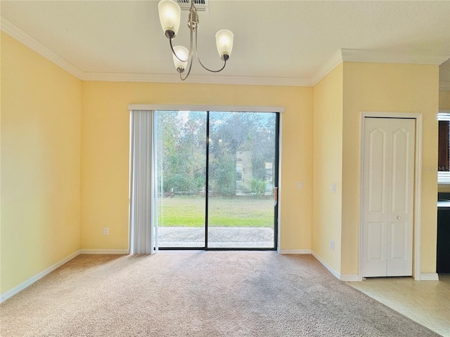 empty room with ornamental molding, carpet floors, and an inviting chandelier