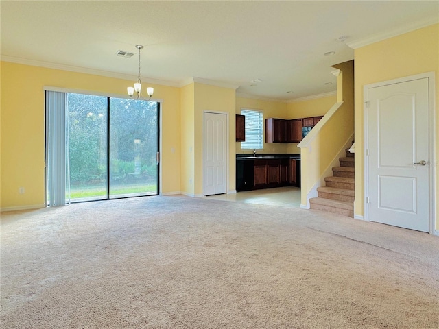 unfurnished living room with crown molding, a chandelier, and light carpet