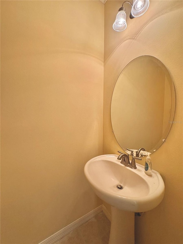 bathroom with tile patterned floors