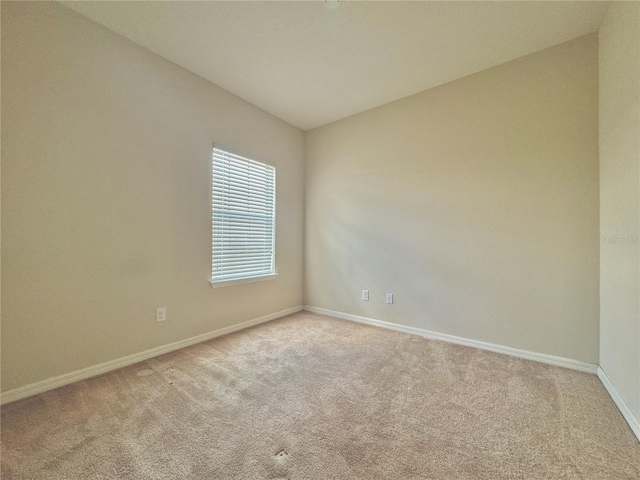 empty room with light colored carpet