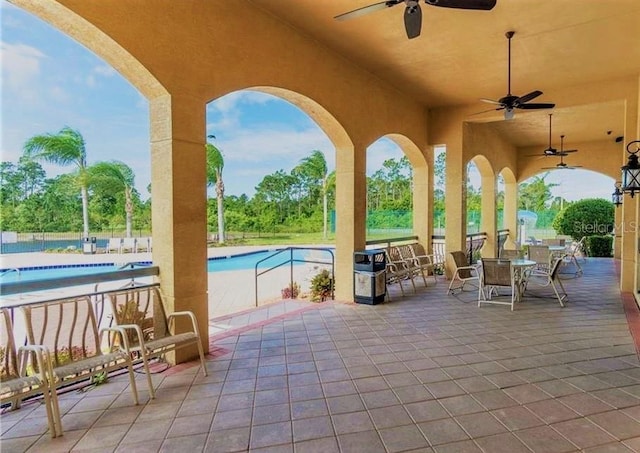 view of patio / terrace featuring a community pool and ceiling fan