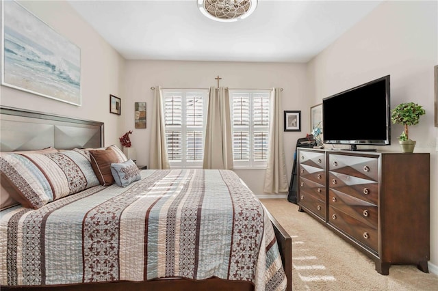 bedroom featuring light colored carpet