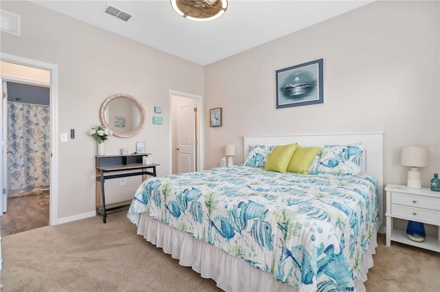 bedroom with light colored carpet