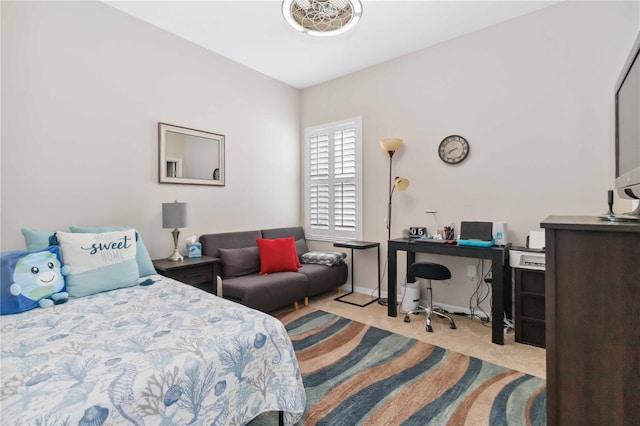 bedroom featuring light carpet