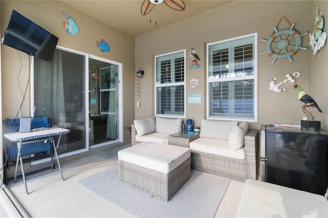 view of patio / terrace featuring an outdoor living space and ceiling fan