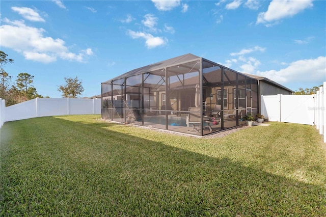 view of yard featuring a fenced in pool, a patio, and glass enclosure