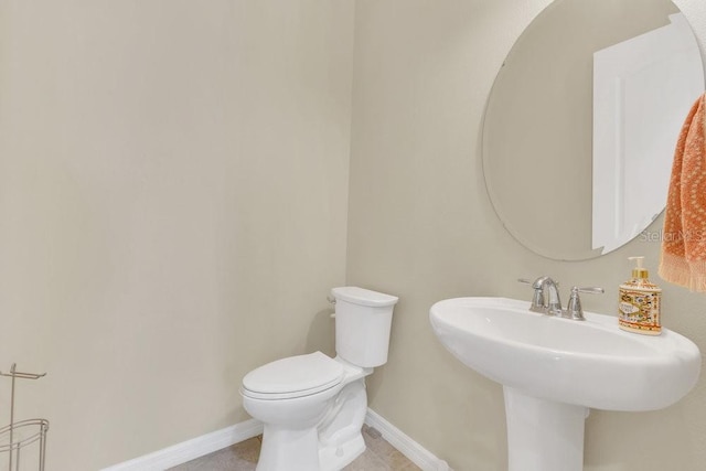 bathroom featuring sink and toilet