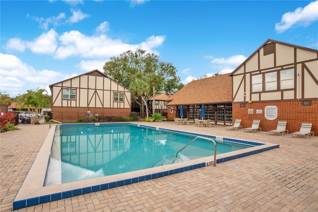 view of pool featuring a patio area