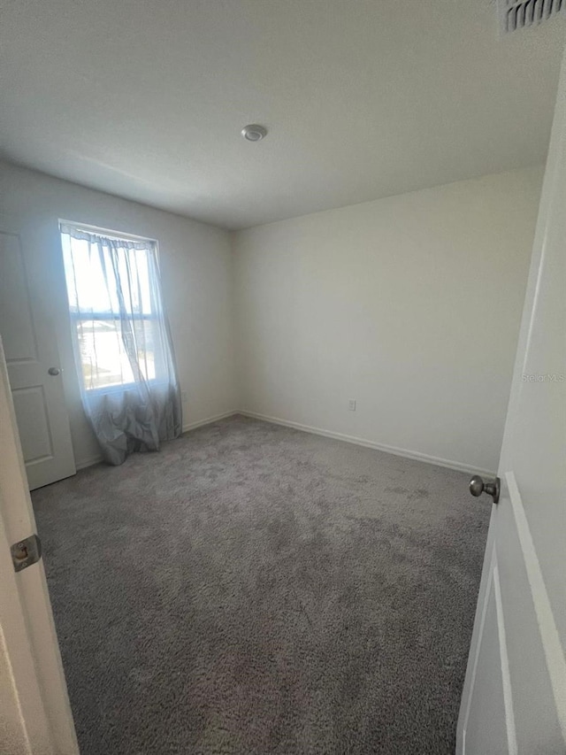 empty room featuring carpet flooring