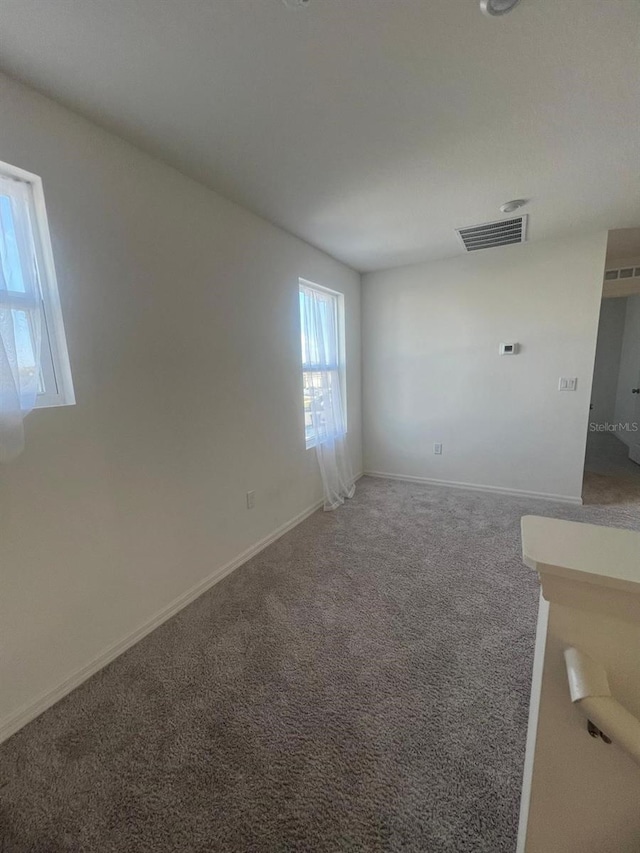 spare room with carpet flooring