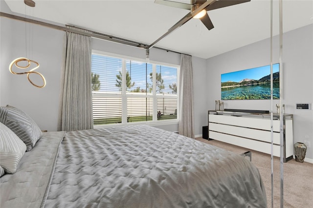 bedroom with light carpet and ceiling fan