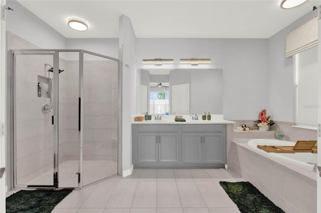 bathroom with vanity, tile patterned flooring, and separate shower and tub