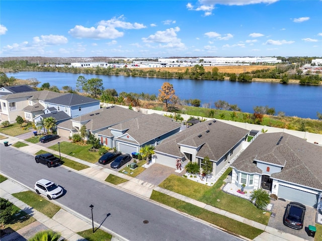 birds eye view of property with a water view