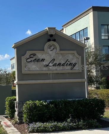 community / neighborhood sign featuring a garage