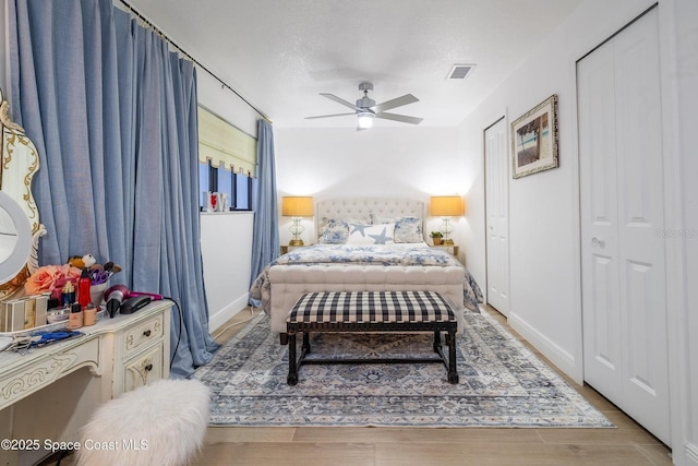 bedroom with ceiling fan and light wood-type flooring