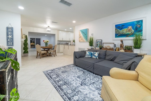 living room with light tile patterned flooring