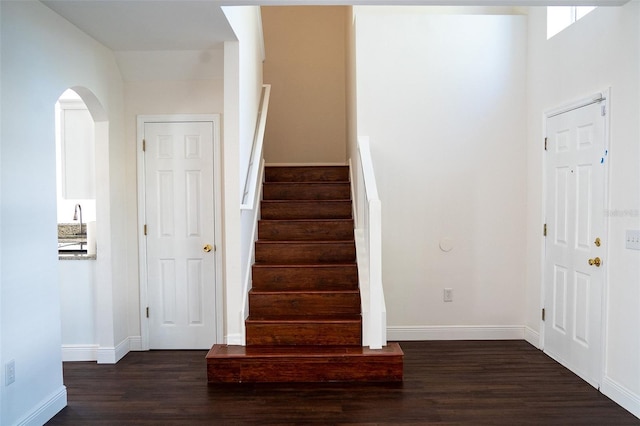 entrance foyer with dark hardwood / wood-style flooring and sink