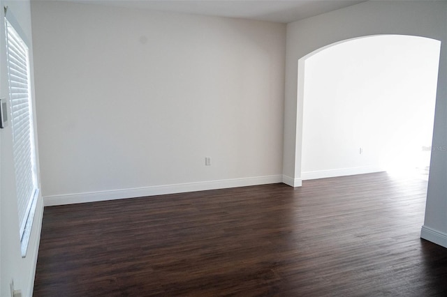 unfurnished room featuring dark hardwood / wood-style floors