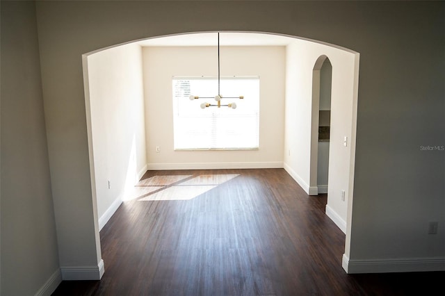 unfurnished dining area featuring dark hardwood / wood-style flooring