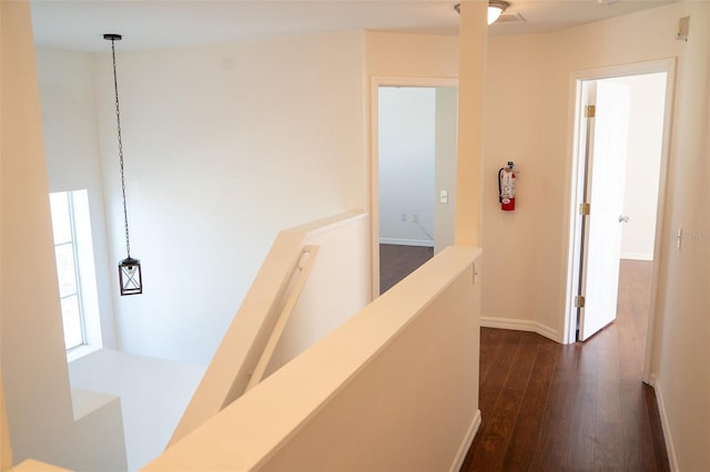 corridor featuring dark hardwood / wood-style flooring