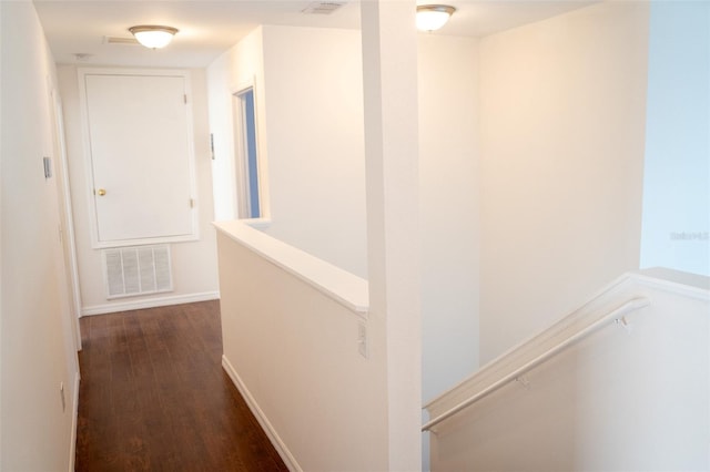 hallway with dark hardwood / wood-style flooring