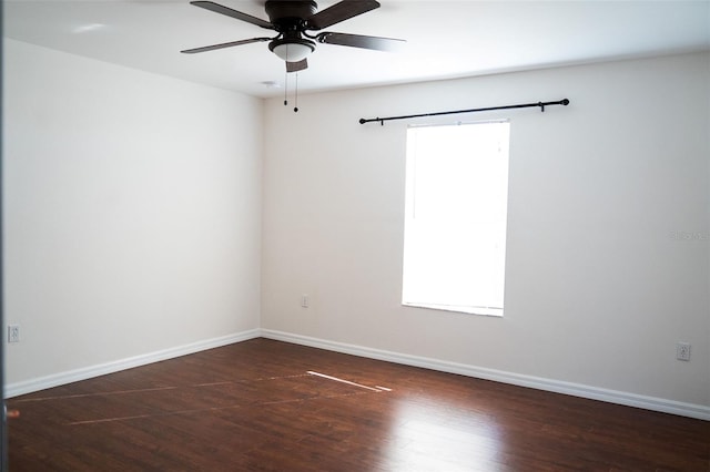 unfurnished room featuring ceiling fan and dark hardwood / wood-style floors