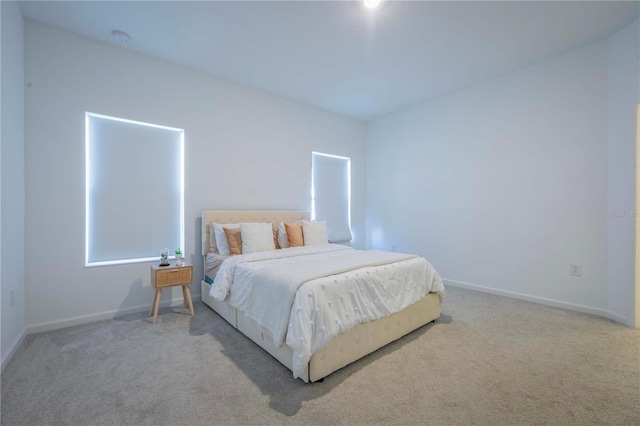 bedroom with light colored carpet