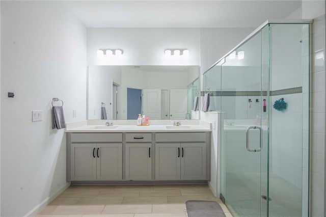 bathroom with vanity and a shower with shower door