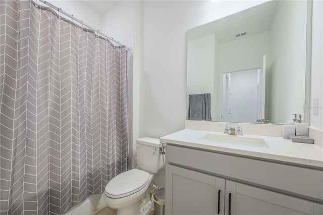 bathroom featuring vanity, a shower with curtain, and toilet