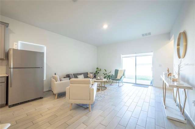 living room with light hardwood / wood-style flooring