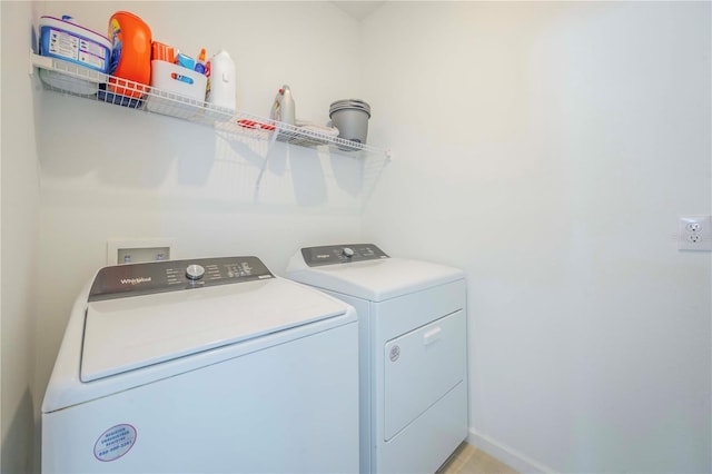 washroom with washer and dryer