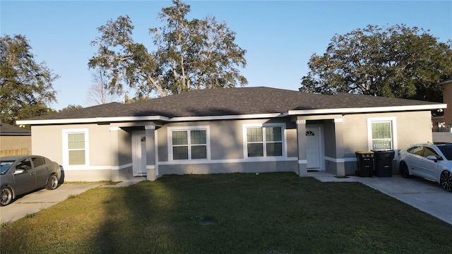 ranch-style home with a front lawn