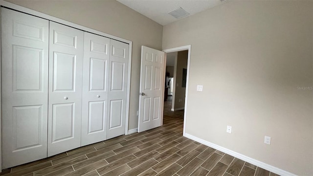 unfurnished bedroom with a closet