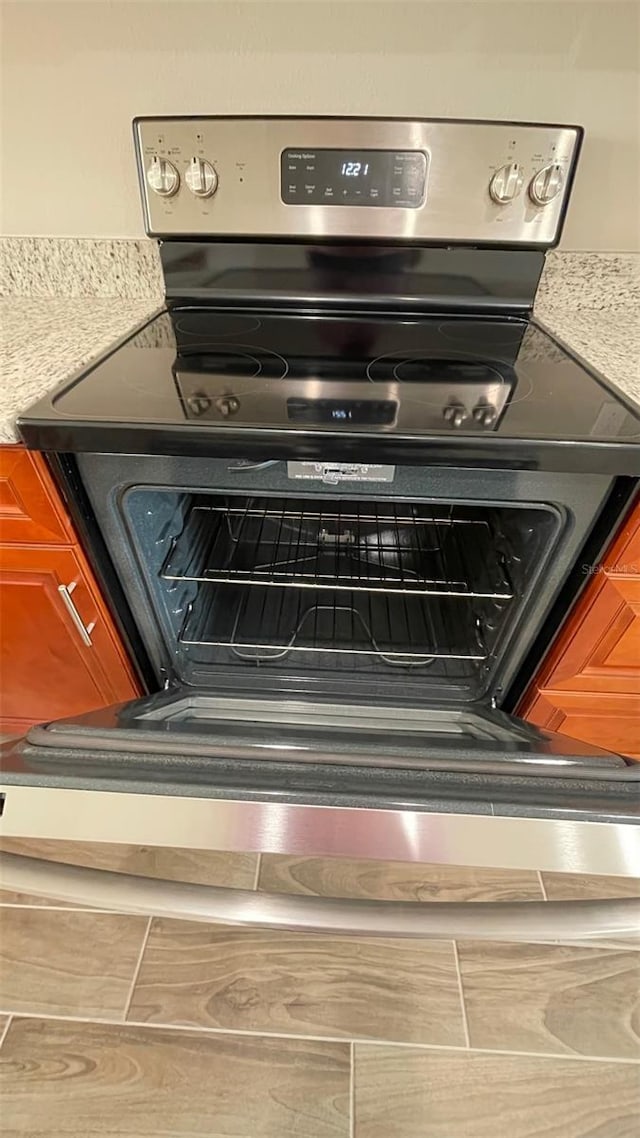 details featuring stainless steel range with electric stovetop