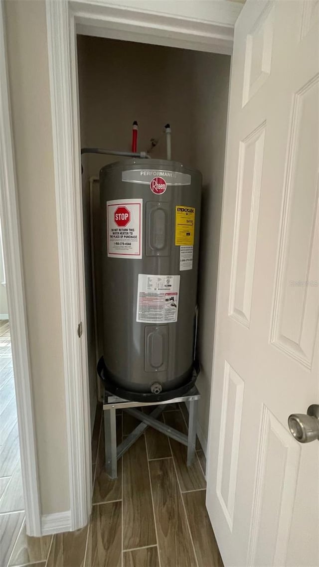 utility room with electric water heater