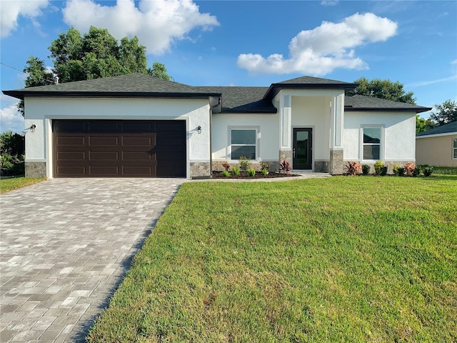 view of front of property with a garage and a front yard