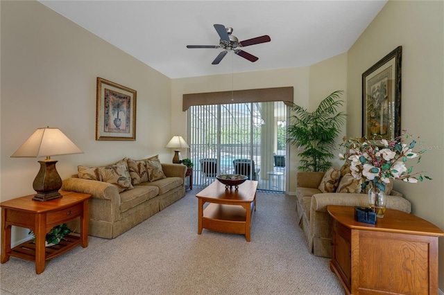 living room featuring light carpet and ceiling fan