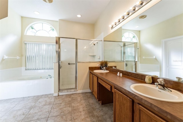 bathroom with independent shower and bath, plenty of natural light, and tile patterned floors