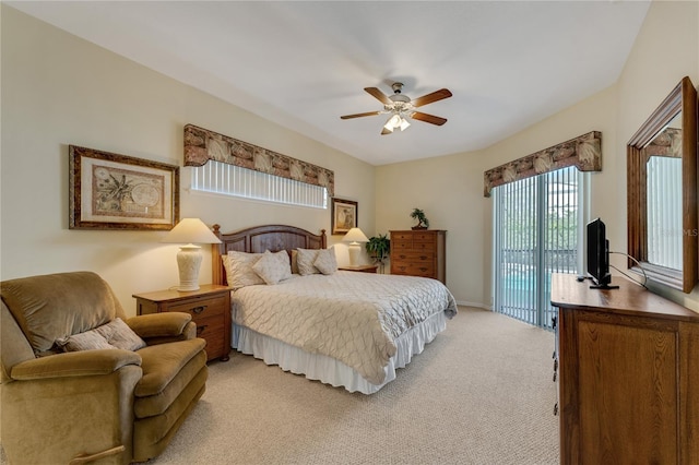 bedroom featuring access to exterior, baseboards, a ceiling fan, and light colored carpet