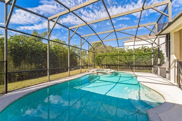 view of swimming pool with an in ground hot tub, a lanai, and a patio area