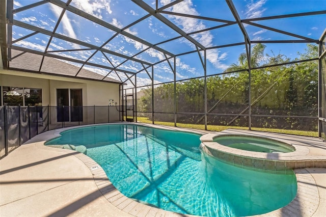 view of swimming pool with a pool with connected hot tub, glass enclosure, and a patio