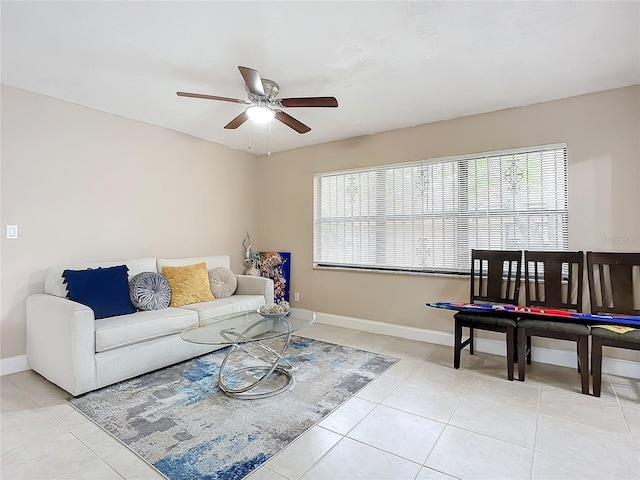 living room featuring light tile patterned floors and ceiling fan