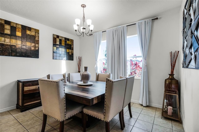 tiled dining space with a chandelier